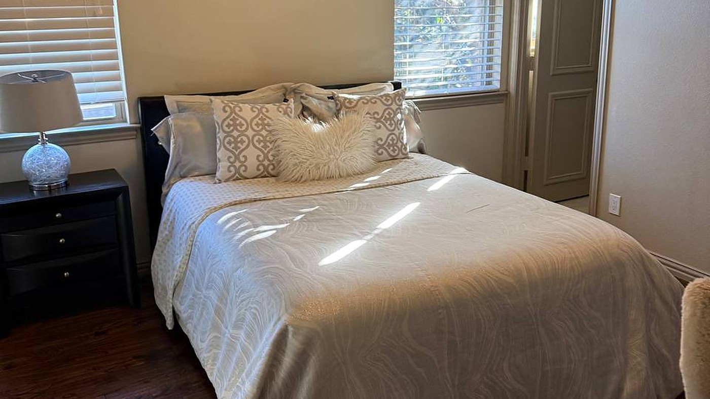 Freshly cleaned bedroom by Irene Cleaning Service in Grapevine, Texas